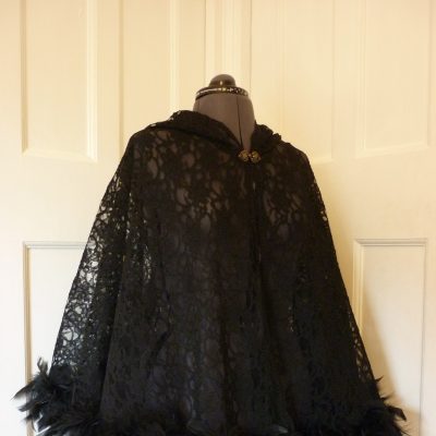 black lace cape with feather trim