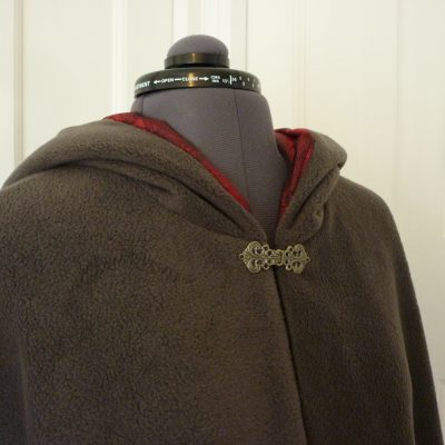 charcoal fleece cape with red jacquard lining